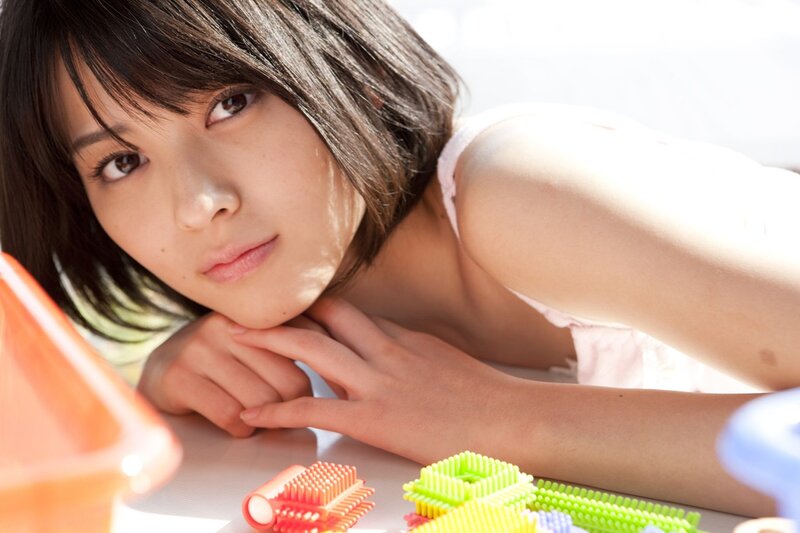 woman resting on table with toys