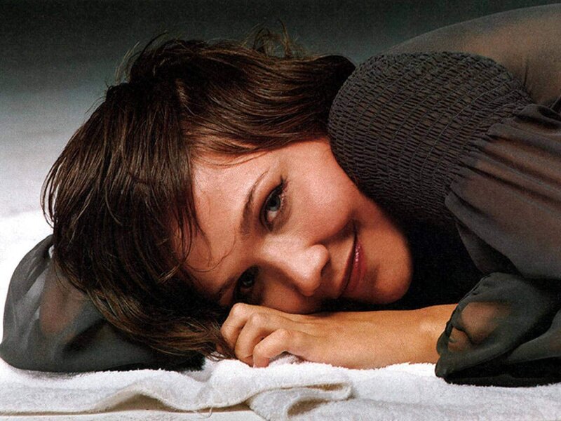 woman resting on towel