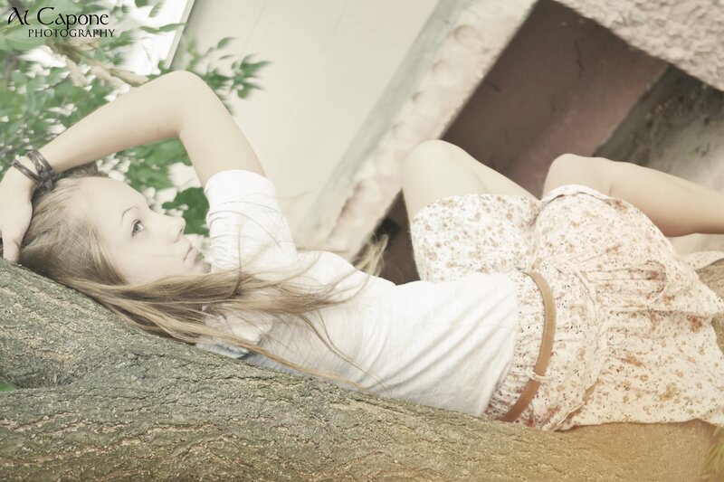 woman resting on tree branch
