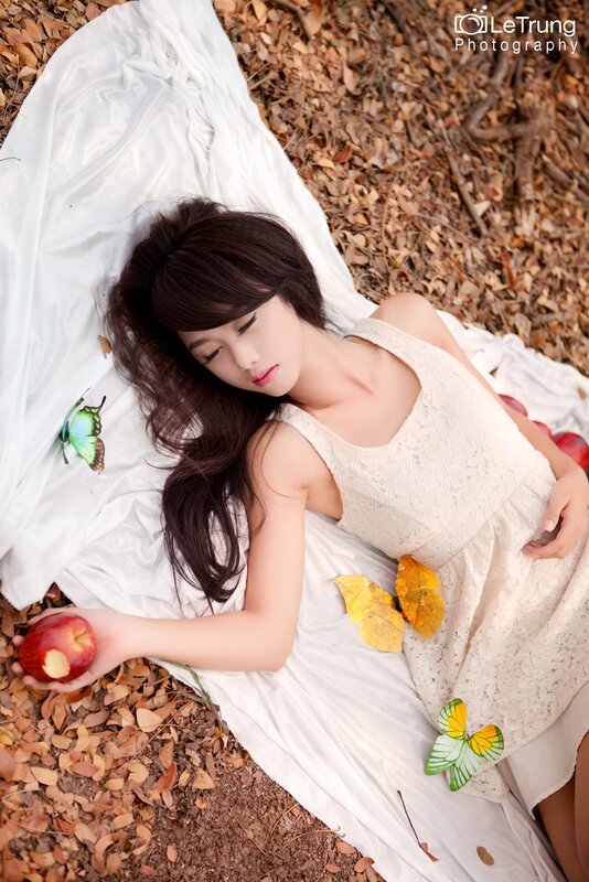 Woman resting on white cloth