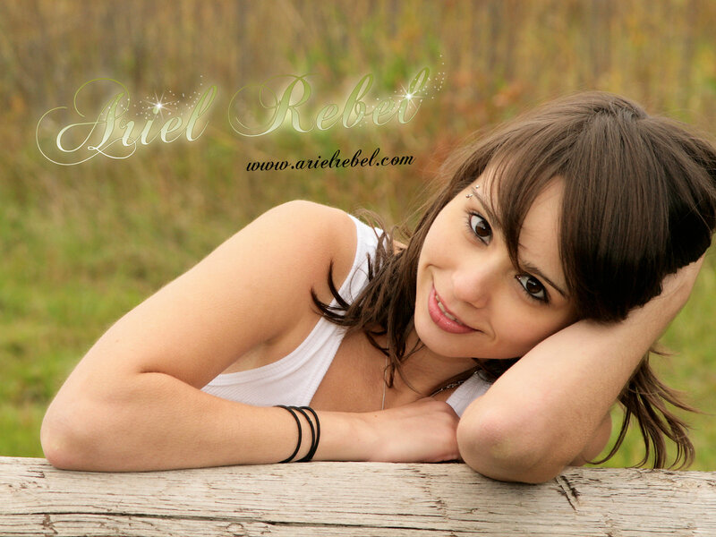 woman resting on wooden log