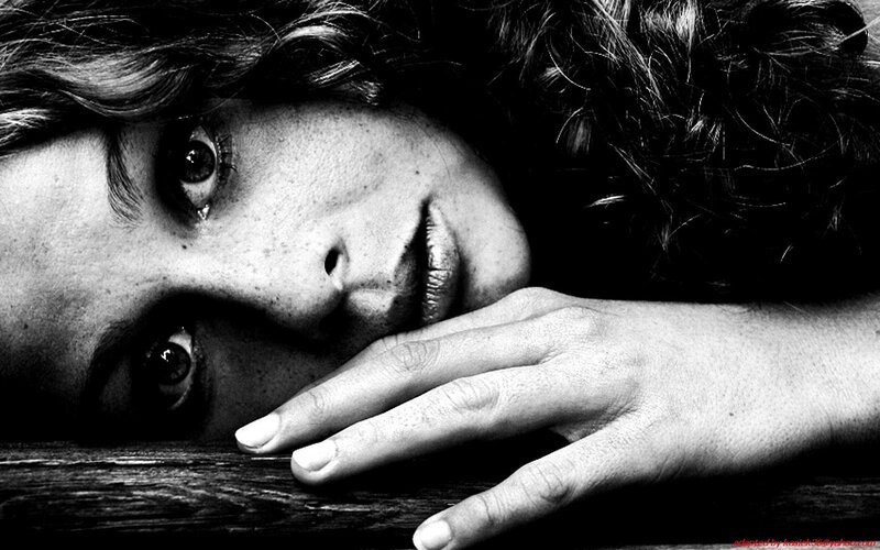 woman resting on wooden surface