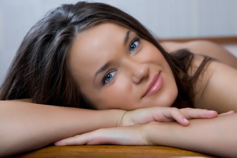 woman resting on wooden surface