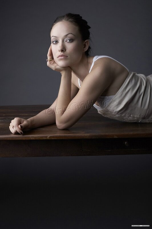woman resting on wooden table