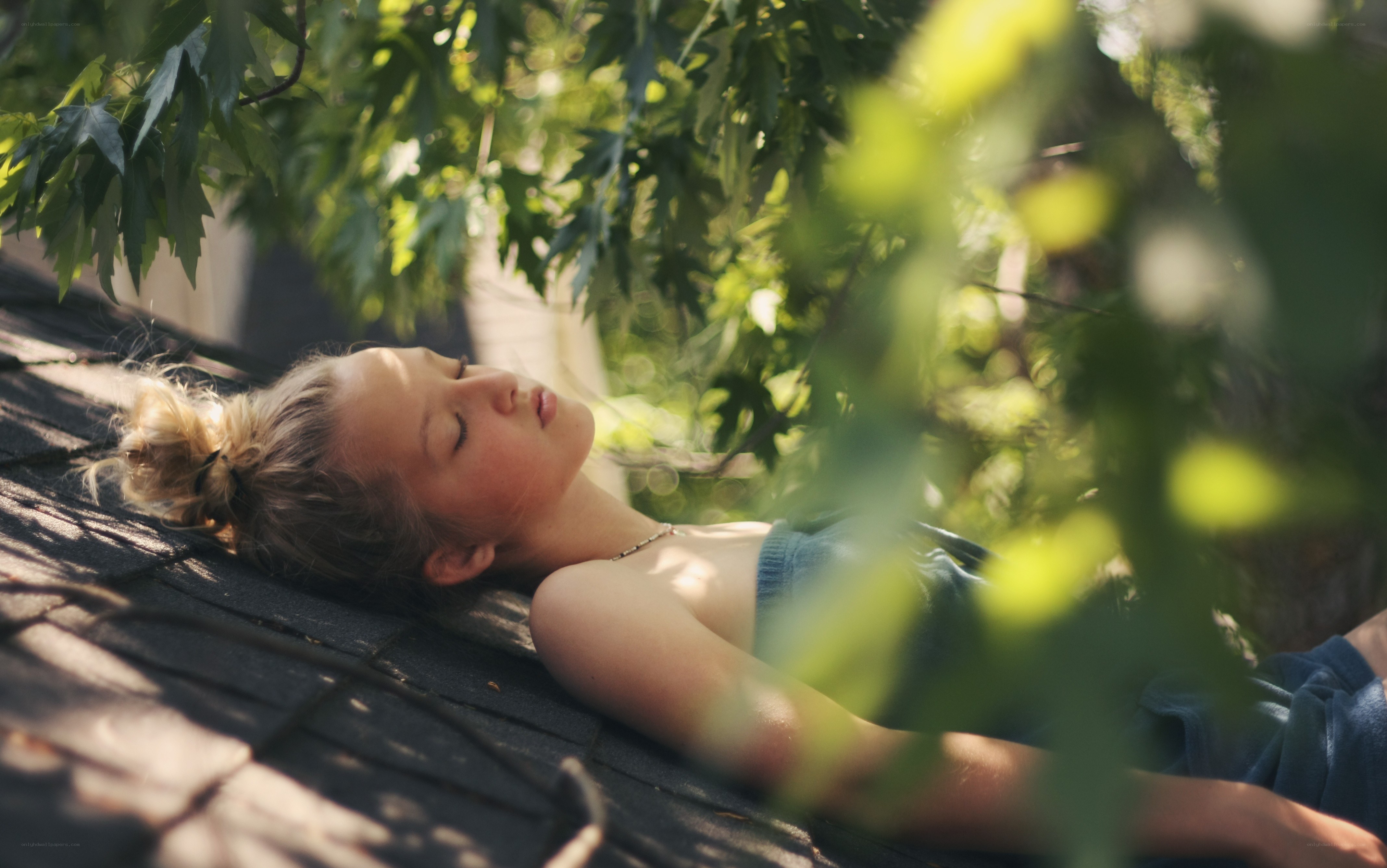 Woman resting under tree