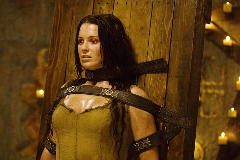woman restrained in dungeon