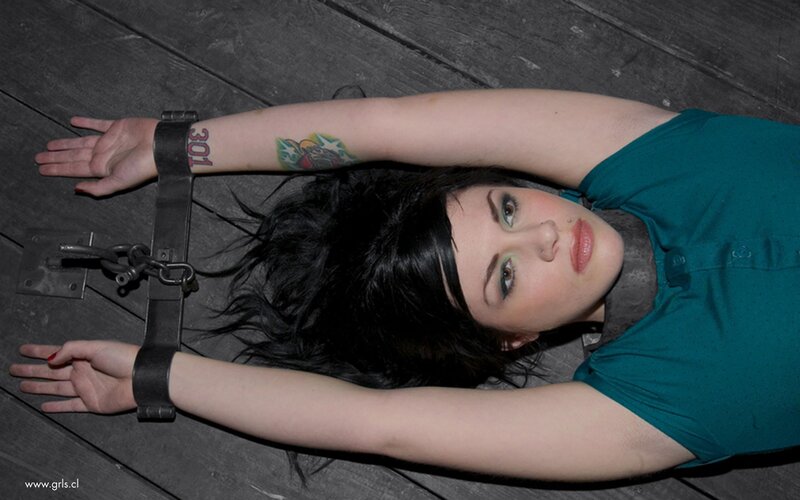 Woman restrained on wooden floor