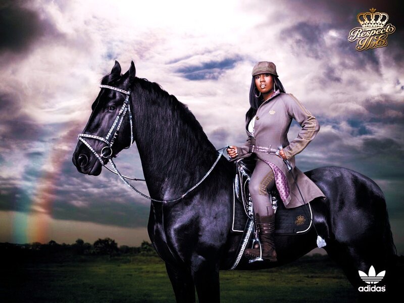 woman riding a black horse