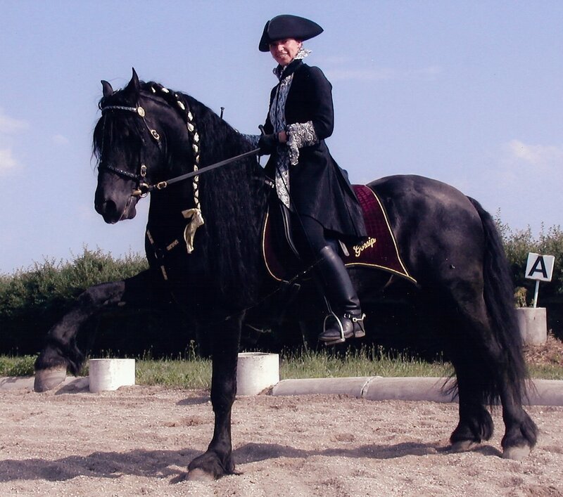 Woman riding a black horse