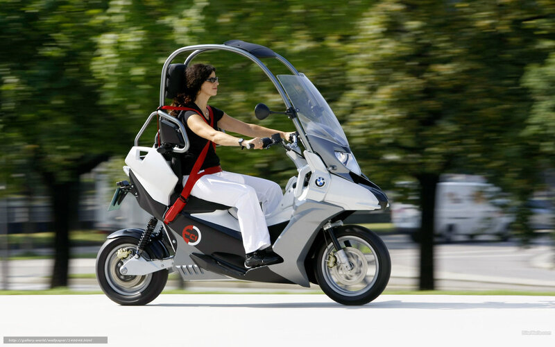 woman riding a futuristic scooter