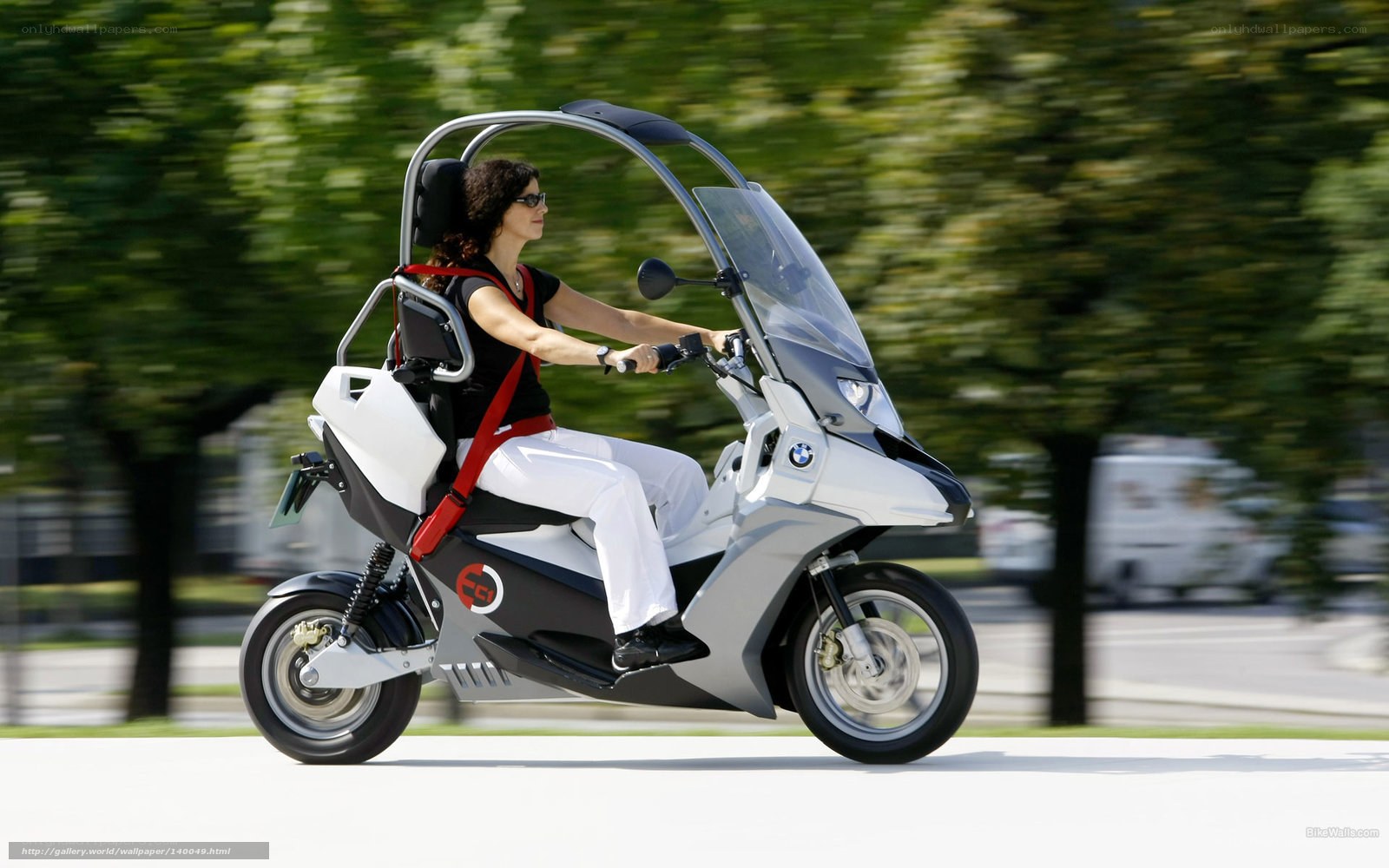 woman riding a futuristic scooter