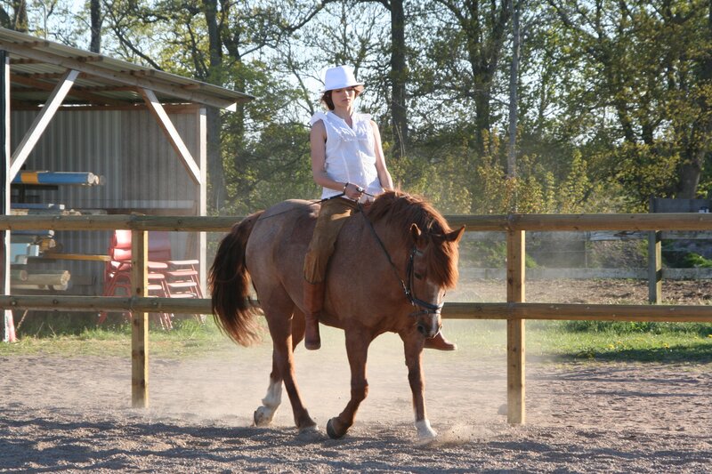 Woman riding a horse