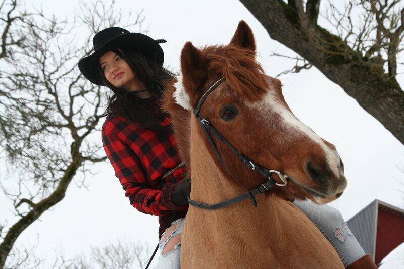 Woman riding a horse in winter