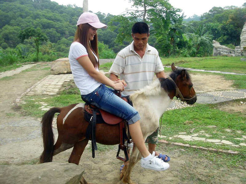 Woman Riding a Pony