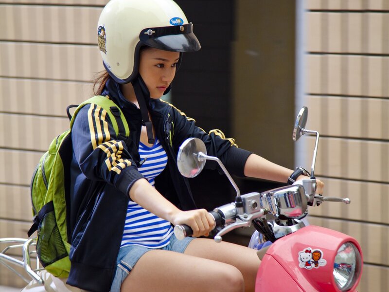 Woman riding a scooter