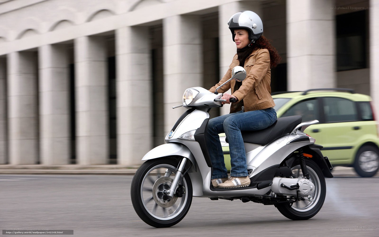 woman riding a scooter