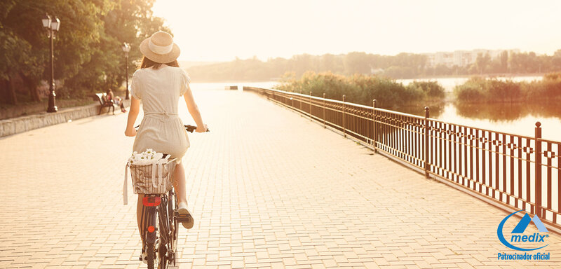 Woman Riding Bicycle — Gold