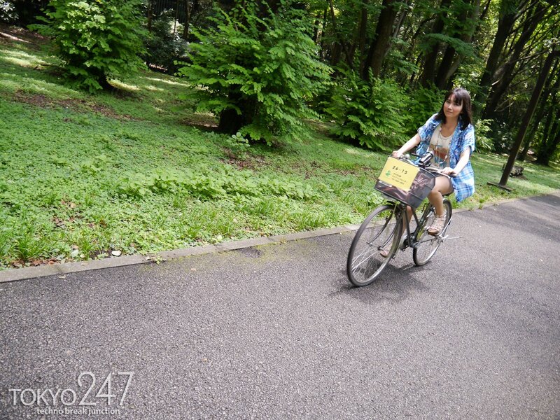 Woman riding bicycle in park