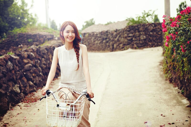 woman riding bicycle on rural path