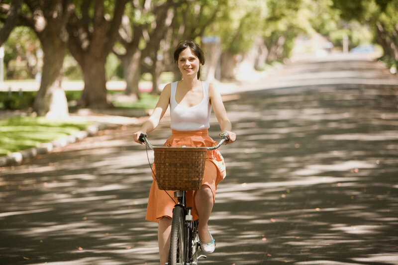 Woman Riding Bicycle — White, Serene, Afternoon, Photograph