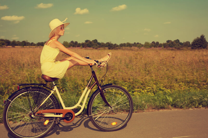 Woman Riding Bicycle — Yellow
