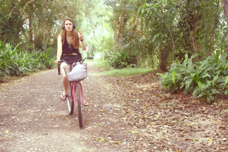 Woman riding bike in forest