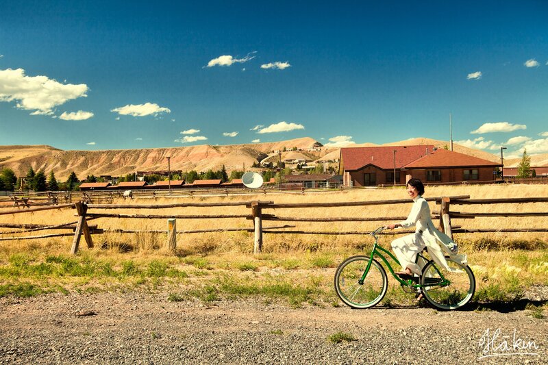 Woman riding bike in rural landscape