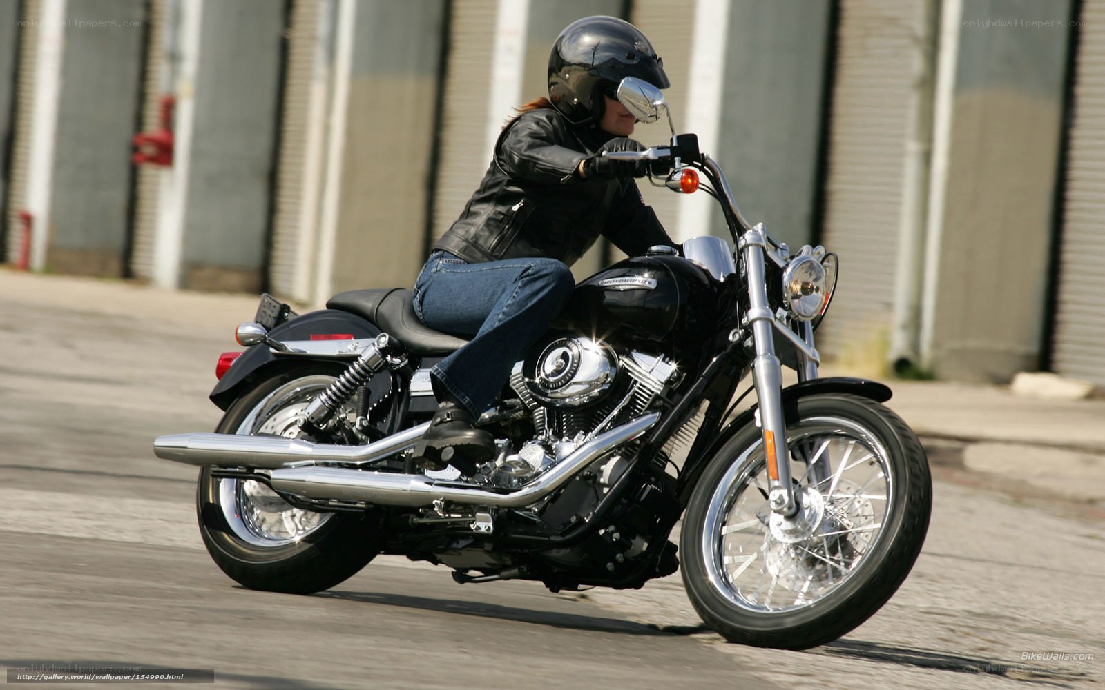 woman riding black motorcycle