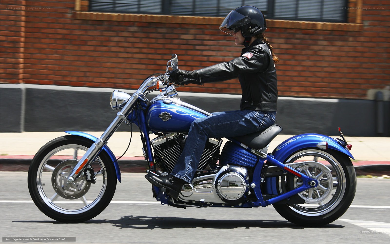 woman riding blue motorcycle
