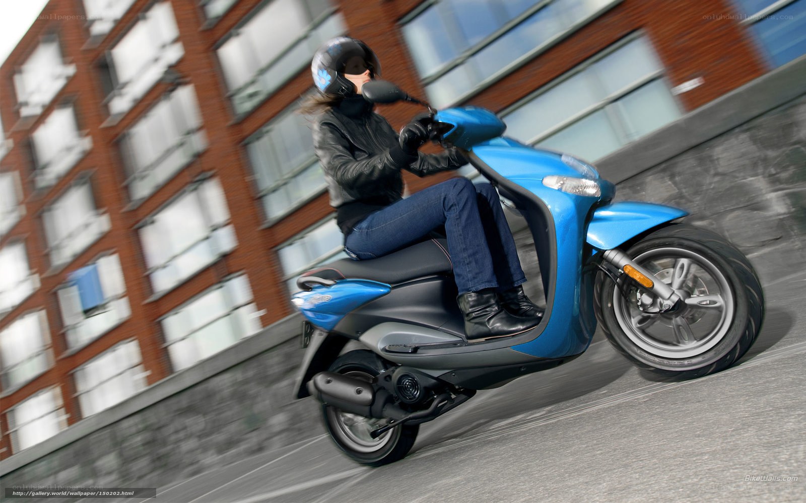Woman riding blue scooter