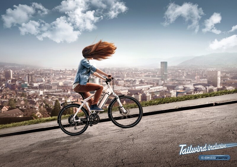 Woman riding e-bike on hill