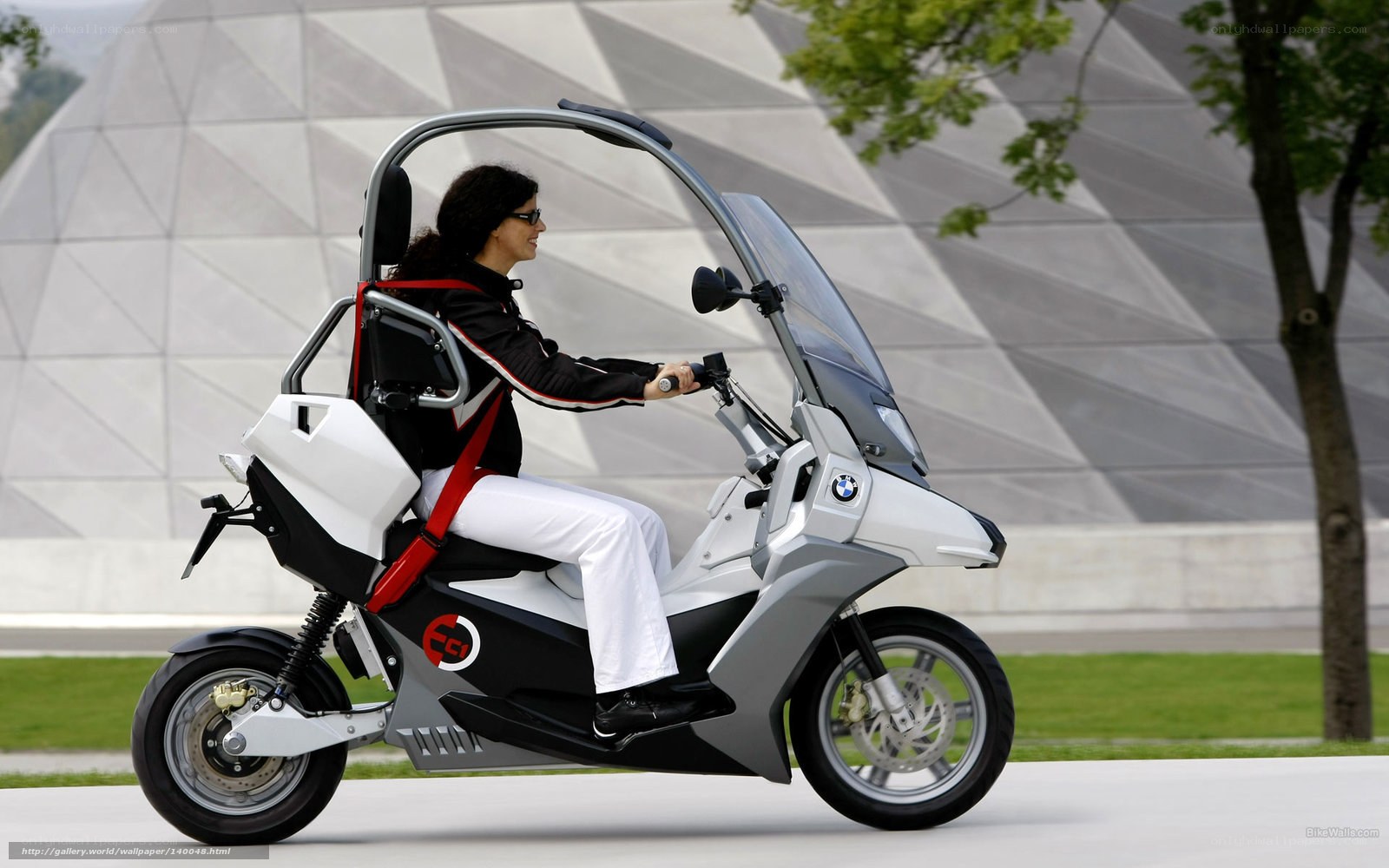 woman riding futuristic scooter