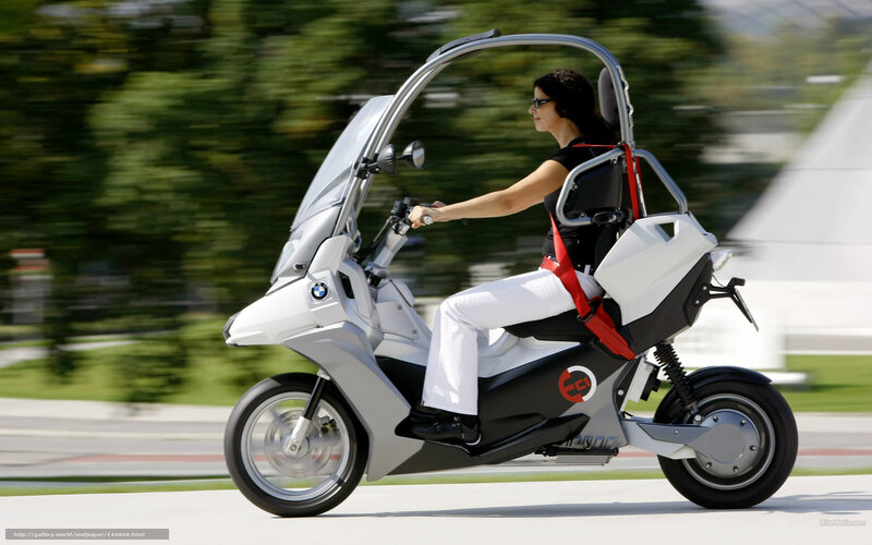 woman riding futuristic scooter