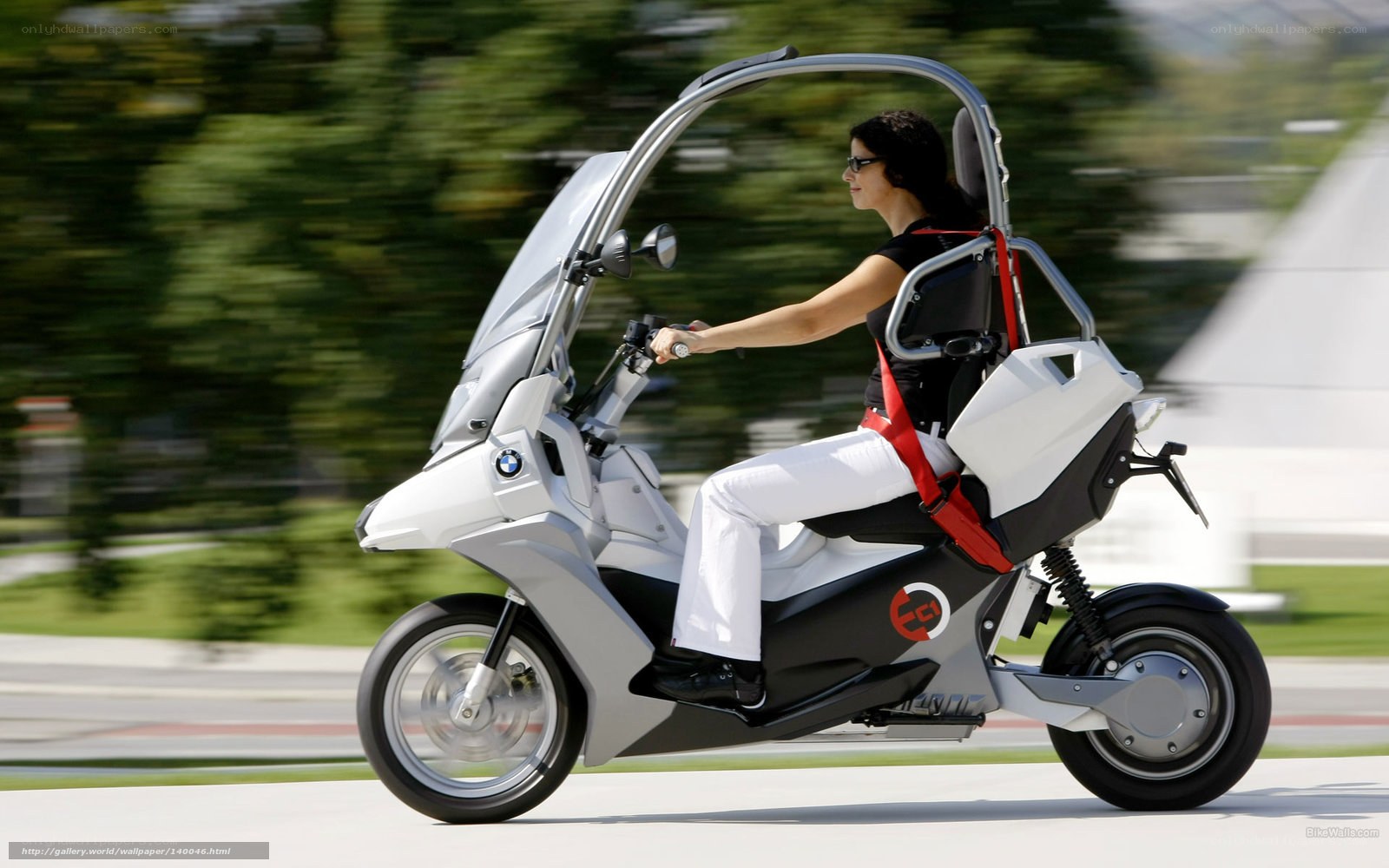 woman riding futuristic scooter