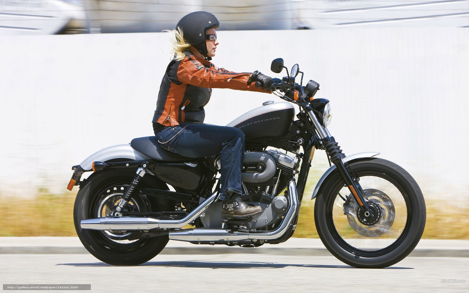woman riding harley-davidson motorcycle