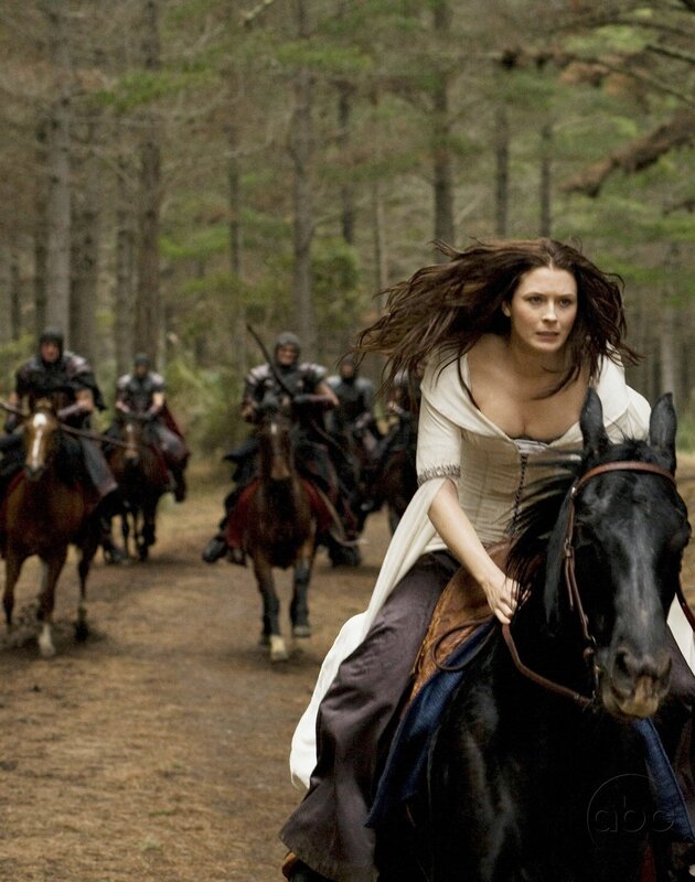 woman riding horse in forest