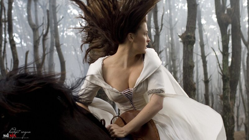 woman riding horse in forest