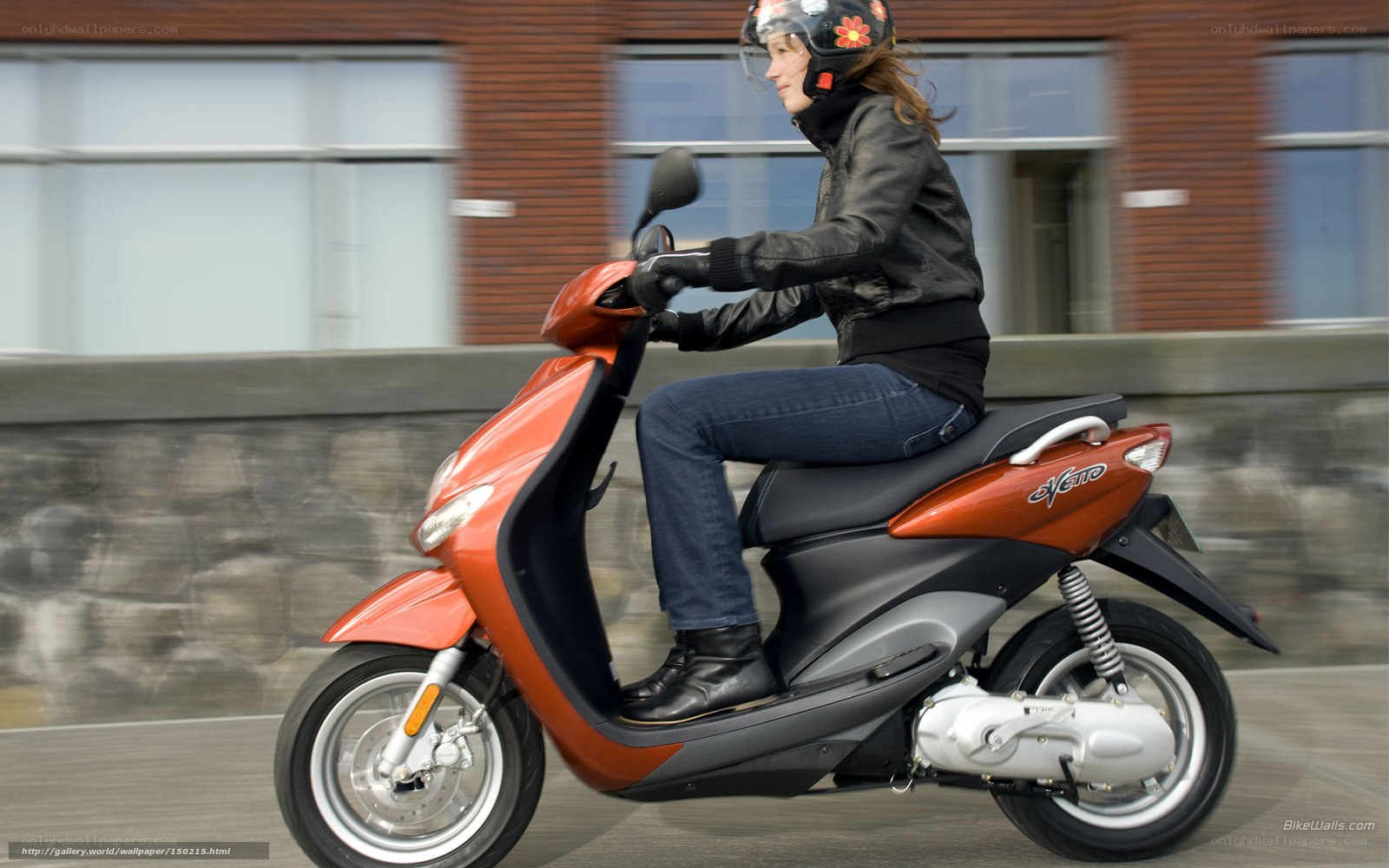 woman riding orange scooter