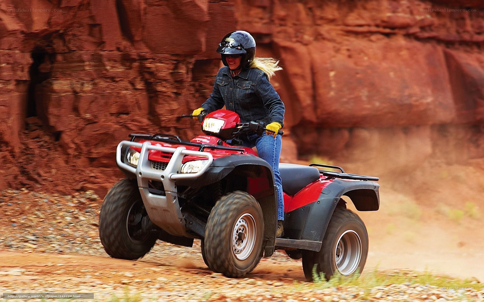 Woman riding red ATV