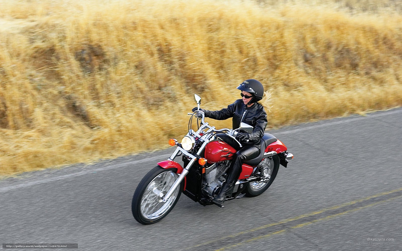 woman riding red motorcycle