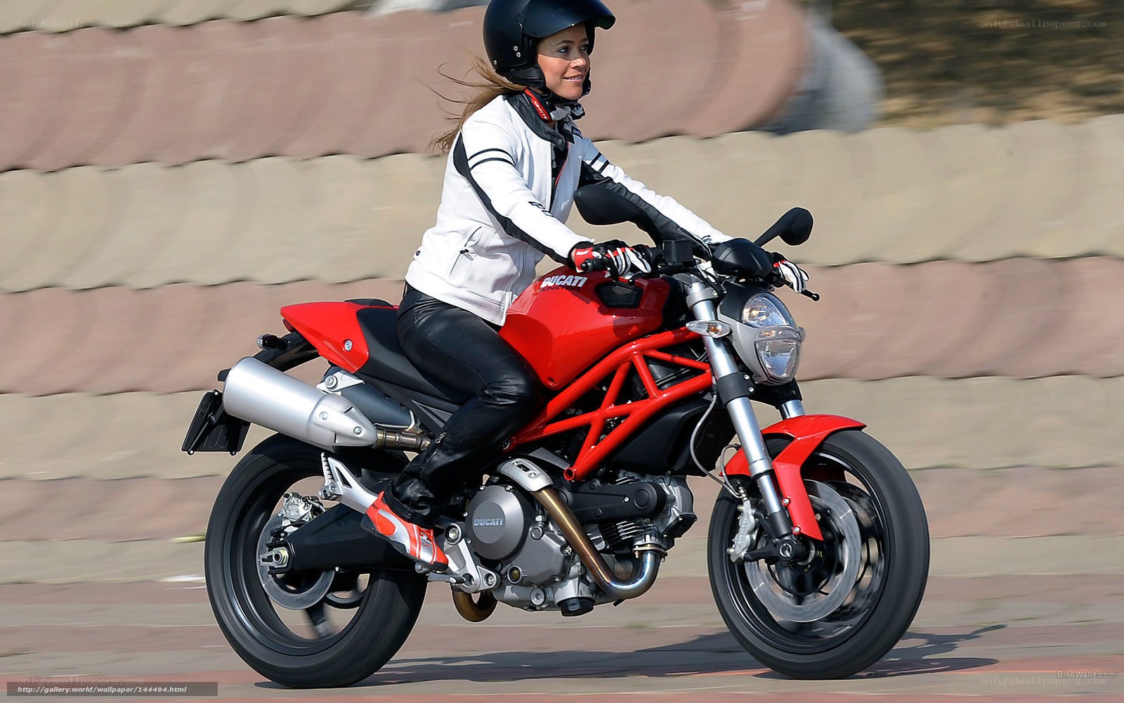 woman riding red motorcycle