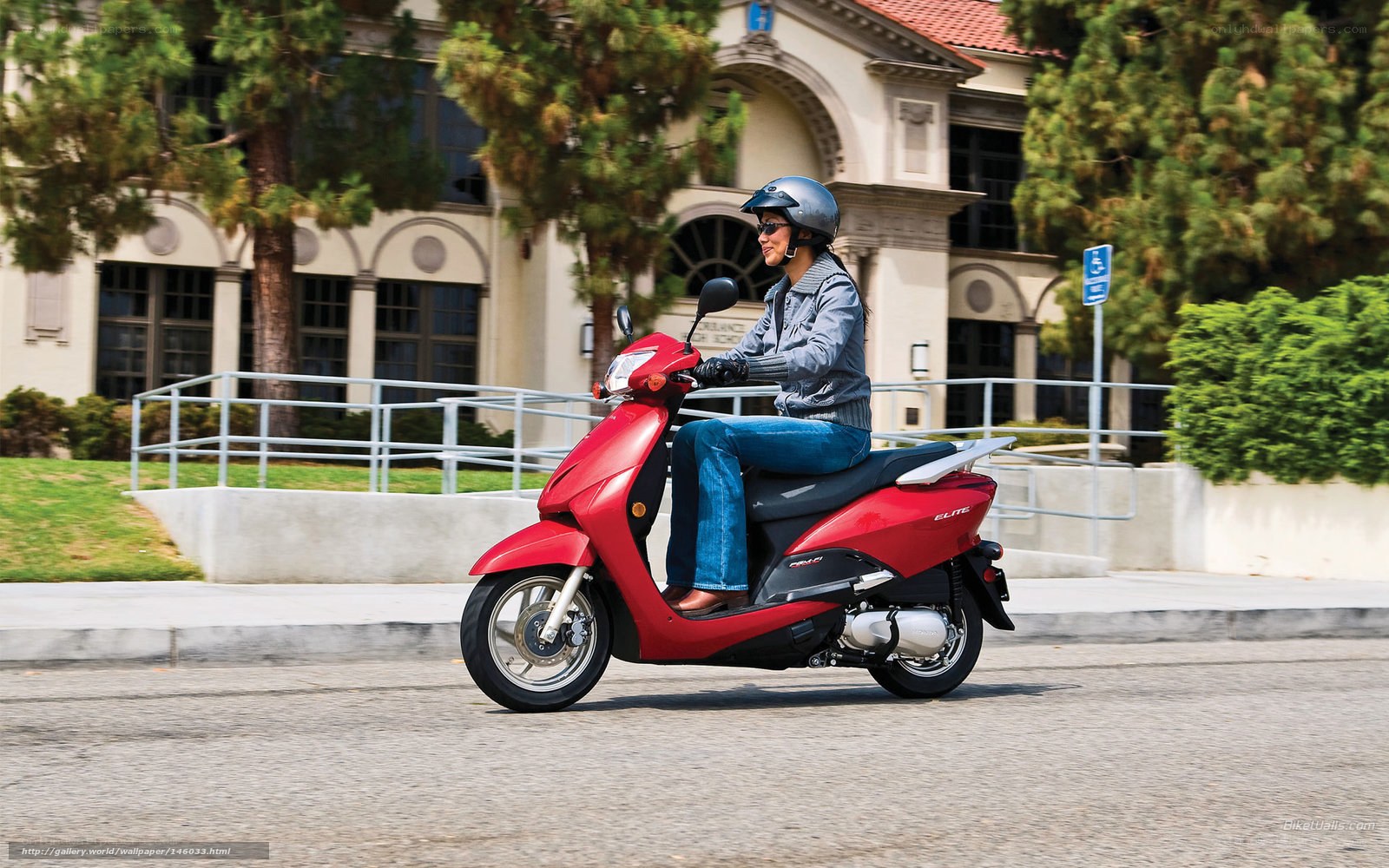 Woman riding red scooter