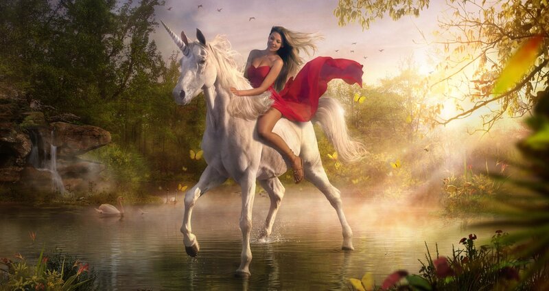 Woman riding unicorn in forest