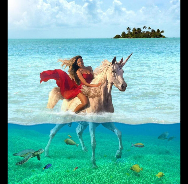 woman riding unicorn in ocean
