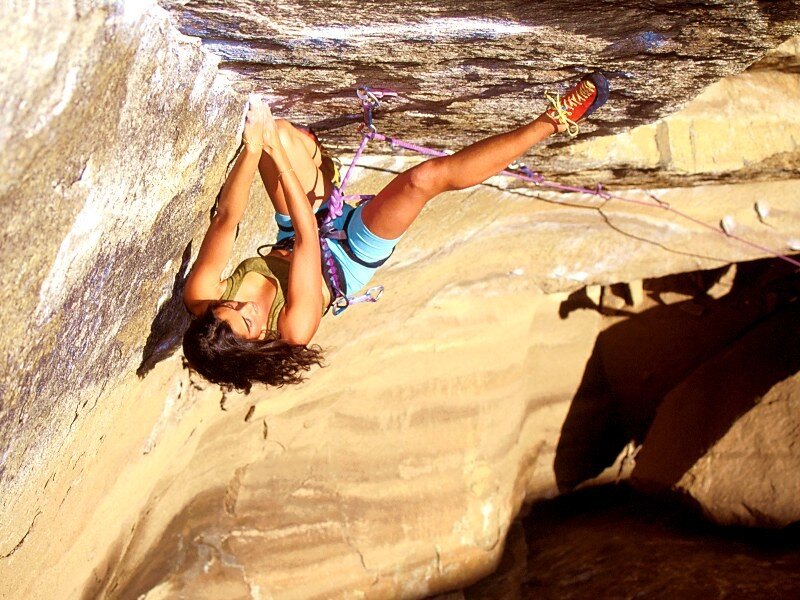 woman rock climbing