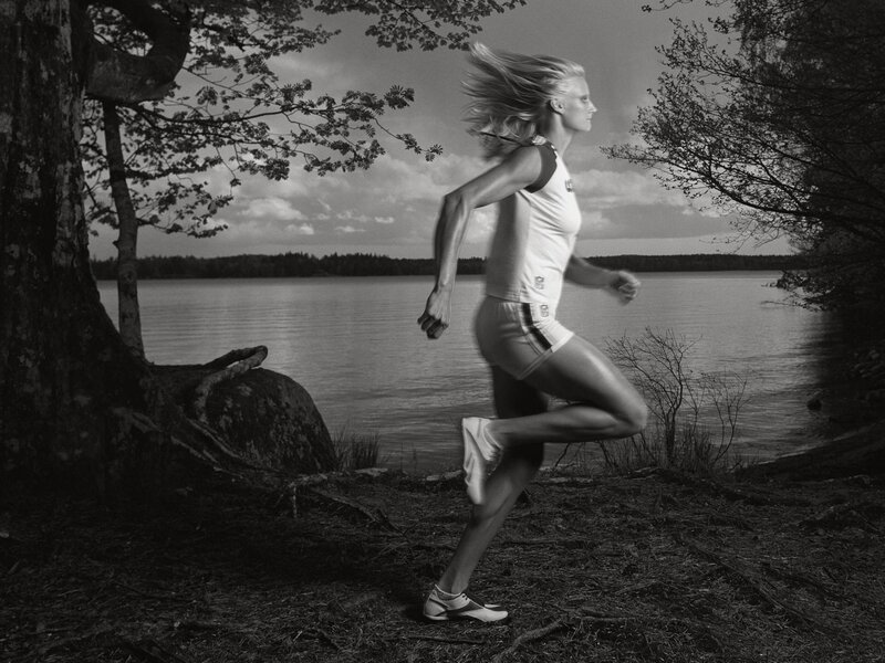 woman running by a lake