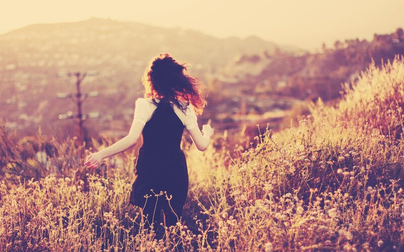 Woman running in a field