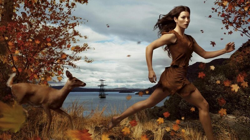 Woman running in autumn landscape