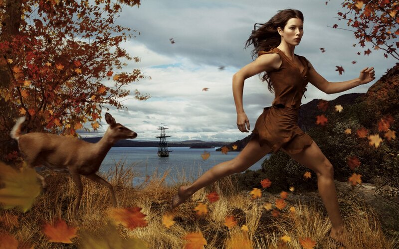 Woman running in autumn landscape