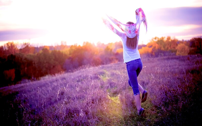 Woman Running in Field — Purple